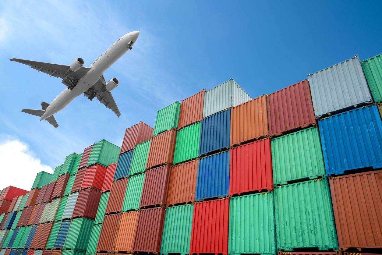 Plane flies over containers stack istock ake1150sb 504606896
